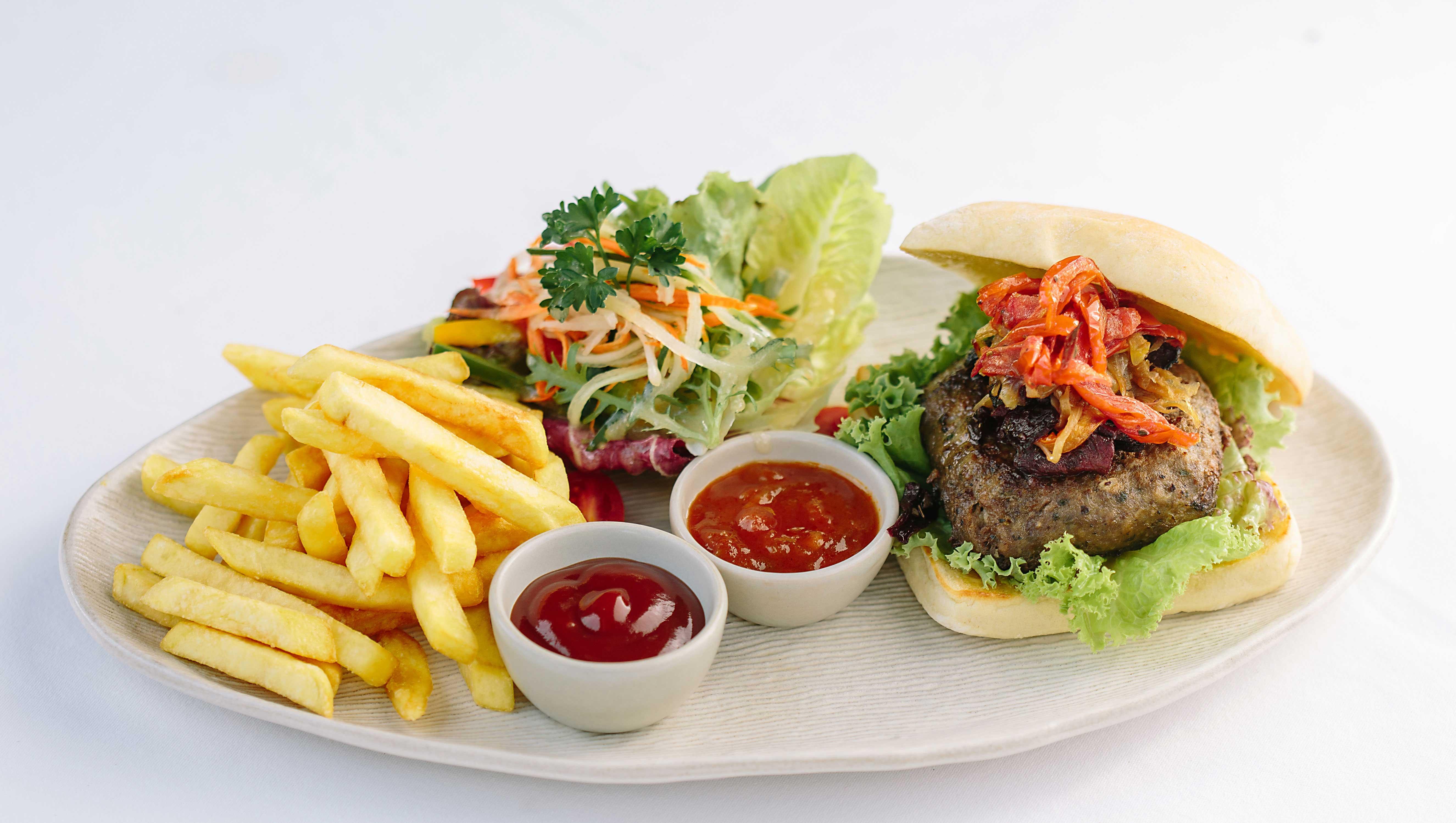 Tejaprana Resort&Spa - CHSE Certified Ubud Exterior foto A hamburger with chips and salad